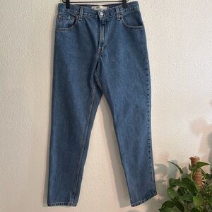 Classic vintage Levi's 550 straight leg tapered denim jeans in medium blue wash